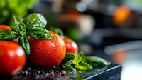 Fresh ripe tomato with water drops and basil leaves on dark background with black peppercorns, macro food photography for restaurant menu.