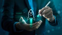 Business professional holding digital rocket hologram representing startup launch, innovation and entrepreneurship growth strategy in modern technology environment.