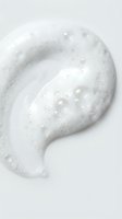 White creamy cosmetic texture with bubbles and droplets on clean background for skincare and beauty product applications.