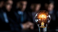 Glowing vintage light bulb with illuminated filament against dark background, symbolizing innovation, creativity and bright business ideas.