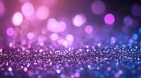 Magical purple and blue bokeh background with glitter sparkle effect and defocused lights creating dreamy atmosphere for festive designs and celebrations.