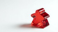 Red metallic star-shaped award or trophy with reflective surface and shadow on white background, suitable for recognition, achievement, and celebration designs.