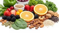 Fresh organic fruits vegetables nuts seeds rich in antioxidants vitamins minerals for healthy balanced diet nutrition wellness lifestyle isolated white background.