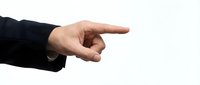 Businessman hand in dark suit sleeve pointing index finger isolated on white background, direction and choice concept.