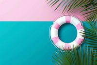 Pink and white striped lifebuoy ring floating on turquoise water with tropical palm leaves creating summer vacation mood, pool party concept.