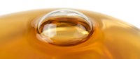Golden liquid with a prominent bubble or droplet suspended on the surface, suitable for cosmetics, skincare, wellness, and beauty product marketing.