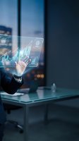 Businessman in dark suit interacting with holographic financial data visualization displaying growth charts and analytics in modern office with city skyline background.