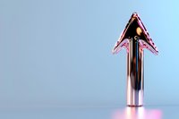 Metallic chrome arrow pointing upward illuminated by pink and blue lighting against gradient background, symbolizing growth, success and forward momentum.