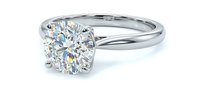 Elegant solitaire engagement ring with brilliant cut diamond on white gold band isolated on white background for jewelry design and wedding concepts.