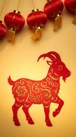 Red paper cut goat with ornate patterns and hanging lanterns on golden background for Chinese New Year celebration and lunar calendar festivities.