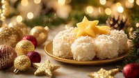 Festive coconut snowball desserts on golden plate with star cookie and Christmas ornaments against blurred bokeh lights and pine branches background.