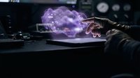 Businessman hand touching holographic cloud computing network with data icons floating above laptop keyboard in modern office technology concept.