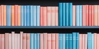 Books arranged on wooden shelves in pastel blue and pink colors creating minimalist aesthetic pattern. Clean modern library or bookstore interior design.