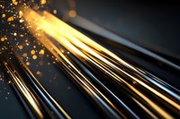 Glowing golden light rays with sparkling particles and bokeh effects on dark background create dramatic atmospheric abstract composition.
