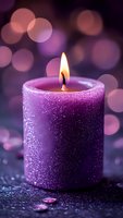 Glittering purple candle with warm flame against soft bokeh background, creating serene atmosphere for meditation, relaxation or festive decor.