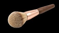 Fluffy powder makeup brush with rose gold ferrule and wooden handle, isolated on transparent background. Great for beauty clipart, stickers, T-shirts, print on demand.
