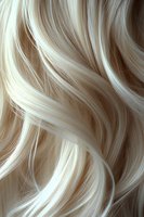 Flowing platinum blonde hair waves create soft curves and highlights, showcasing luxurious texture and natural movement for beauty and fashion industry use.