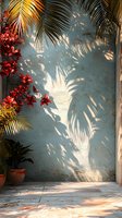 Tropical palm leaves cast dramatic shadows on weathered blue wall with vibrant red orchids and terracotta pot, creating serene summer atmosphere in sunlit corner.