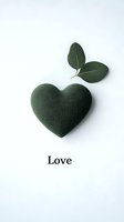 Green heart-shaped object with eucalyptus leaves and love text on white background. Minimalist eco-friendly concept for sustainable living and natural wellness.