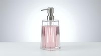 Elegant pink liquid soap dispenser with chrome pump on clean white background for bathroom and kitchen decor applications.