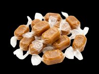 Wrapped caramel candies pile isolated on transparent background, ready for sticker, clipart, print on demand, sublimation, and t-shirt design use.