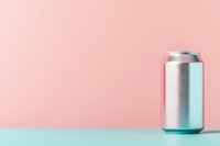 Minimalist composition featuring aluminum beverage can on mint green surface against soft pink background, creating modern pastel color palette.