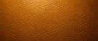 Warm bronze leather texture with subtle grain pattern, suitable for backgrounds, design projects, and branding materials.