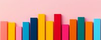 Colorful books arranged in row creating vibrant rainbow pattern on pink background for education, reading and library concepts.