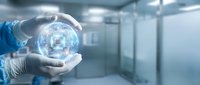 Person in medical or laboratory attire holding glowing digital sphere with circuit patterns, representing technology, innovation, and healthcare advancement in modern facility setting.