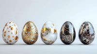 Decorative Easter eggs with modern abstract patterns in gold, black and white colors arranged in row on light background. Luxury marble and metallic textures.