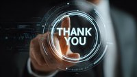 Businessman touching futuristic digital interface with thank you message on virtual screen, showing customer appreciation in modern business environment.