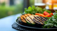 Grilled eggplant slices with char marks served on black plate with fresh herbs and cherry tomatoes, selective focus on foreground vegetables.
