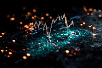 Stock market graph with glowing turquoise particles and orange bokeh lights on dark background, financial data visualization for investment analysis.