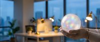 Hand holding a glowing translucent crystal ball in a modern office, symbolizing future vision, business prediction, and innovation.