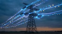 High voltage electrical transmission tower with glowing digital energy streams and data points against dramatic sky for smart grid technology concepts.