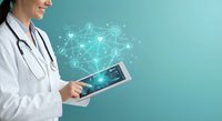 Female doctor using digital tablet with medical network connections and healthcare technology interface on turquoise background for telemedicine applications.