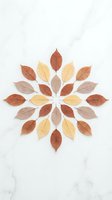 Autumn leaves arranged in circular mandala pattern on white marble background for seasonal decoration and craft projects.