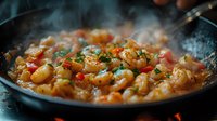 Steaming hot shrimp in spicy sauce with garlic and herbs cooking in black pan, close up view of seafood dish with rising smoke and aromatic seasonings.