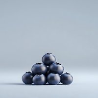 Fresh ripe blueberries stacked in pyramid shape on light gray background, minimal composition with soft shadows and clean aesthetic.