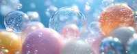 Colorful translucent spheres with glowing particles and bokeh effects on soft blurred background, suitable for abstract backgrounds and digital design projects.