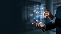 Businessman touching futuristic holographic interface with connected network icons in modern office environment for digital transformation concepts.
