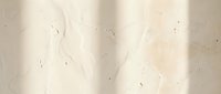 Cream colored marble surface with natural veining and subtle texture, suitable for backgrounds, design projects, and architectural visualization.