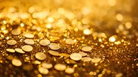 Shimmering golden bokeh background with scattered metallic circles creating magical light effects and glowing sparkles on dark surface. Luxury abstract backdrop.