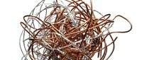 Tangled copper wire and metal strands in chaotic arrangement, representing confusion, complexity, or electrical concepts for design and industrial projects.
