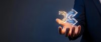 Business professional holding glowing digital dollar signs in cupped hands representing financial growth, investment opportunities and wealth management concepts.