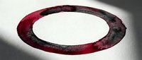 Abstract red and black circular ring with grunge texture and dramatic shadow on white background for modern graphic design projects.