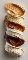 Abstract spiral sculpture with layered brown and cream textures creating dynamic twisted form on neutral background for modern interior design.