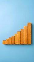 Wooden blocks arranged in ascending bar chart formation on light blue background, representing growth, progress, and business success metrics.
