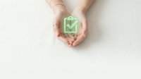 Hands protecting green download icon symbol representing data security, cloud storage protection, and digital file safety for business technology concepts.