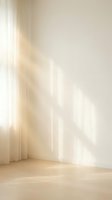 Soft sunlight streaming through sheer curtains creates warm golden rays and shadows on minimalist interior wall and wooden floor for peaceful home atmosphere.